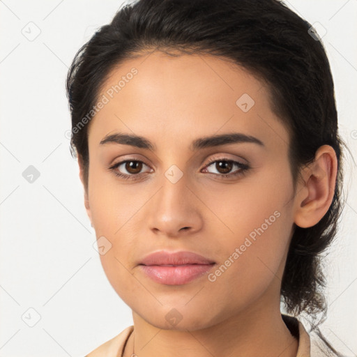 Joyful latino young-adult female with medium  brown hair and brown eyes