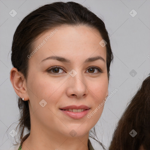 Joyful white young-adult female with long  brown hair and brown eyes