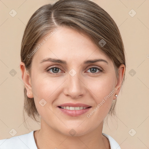 Joyful white young-adult female with medium  brown hair and grey eyes