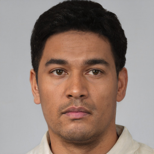 Neutral latino young-adult male with short  black hair and brown eyes