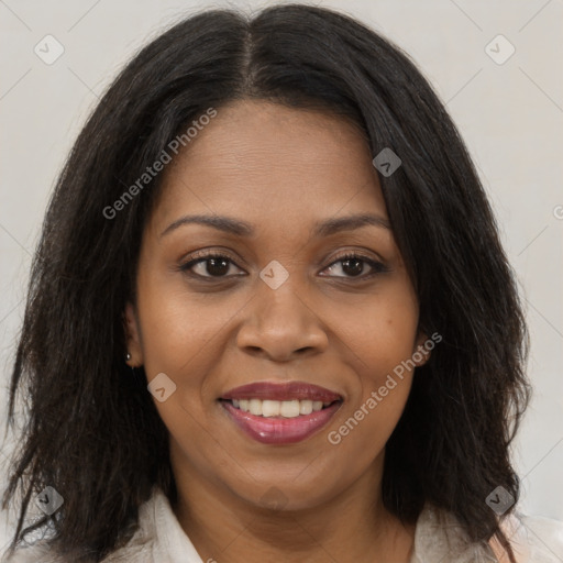 Joyful black young-adult female with long  brown hair and brown eyes