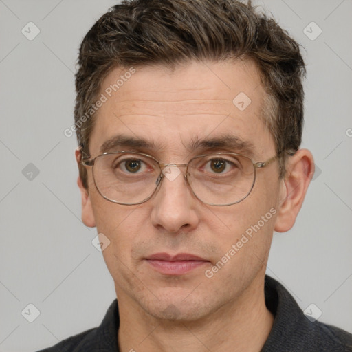 Joyful white adult male with short  brown hair and grey eyes