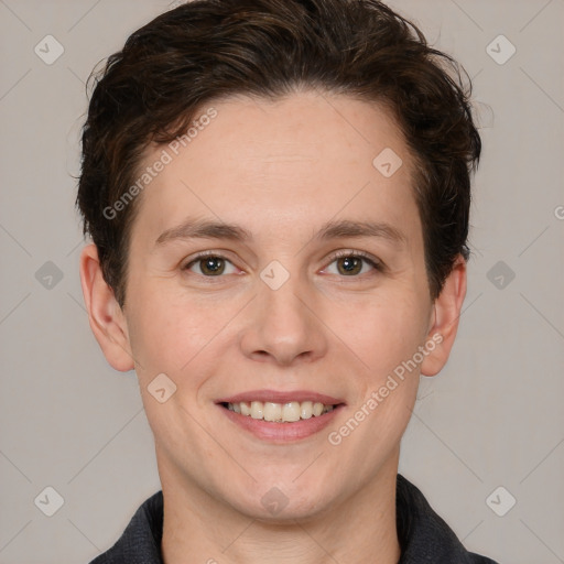 Joyful white young-adult female with short  brown hair and grey eyes