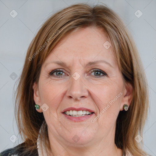 Joyful white adult female with medium  brown hair and grey eyes