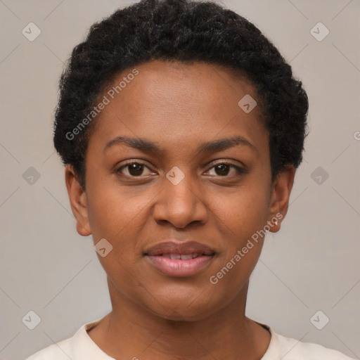 Joyful black young-adult female with short  black hair and brown eyes