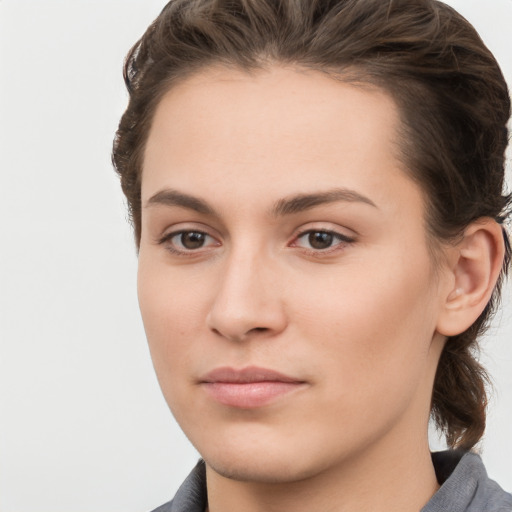 Neutral white young-adult female with medium  brown hair and brown eyes