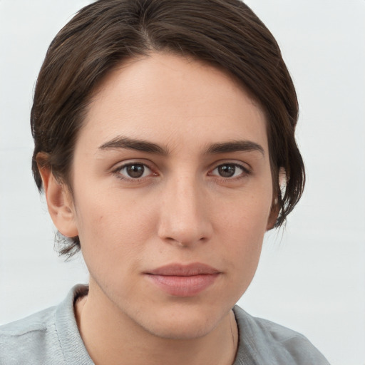 Neutral white young-adult female with short  brown hair and brown eyes