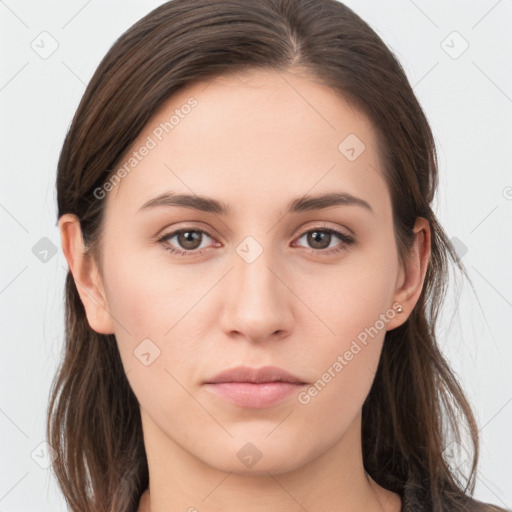 Neutral white young-adult female with long  brown hair and grey eyes