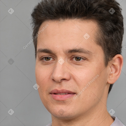 Joyful white adult male with short  brown hair and brown eyes