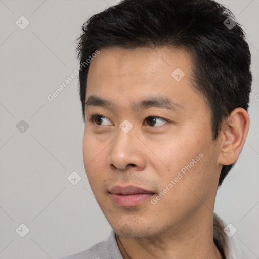 Neutral asian young-adult male with short  black hair and brown eyes