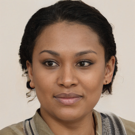 Joyful latino young-adult female with medium  brown hair and brown eyes