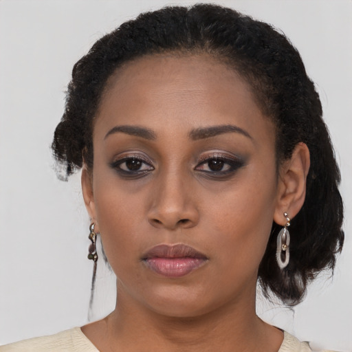 Neutral black young-adult female with medium  brown hair and brown eyes