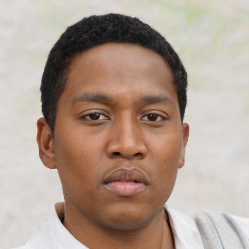 Neutral black young-adult male with short  black hair and brown eyes
