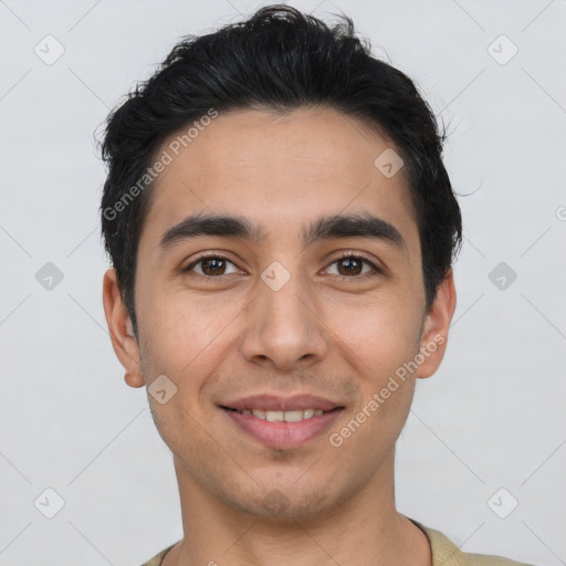 Joyful white young-adult male with short  black hair and brown eyes