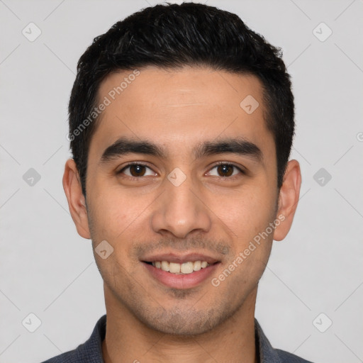 Joyful white young-adult male with short  black hair and brown eyes