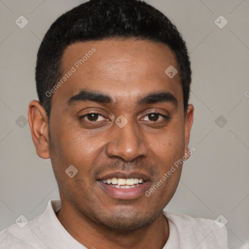 Joyful black young-adult male with short  black hair and brown eyes