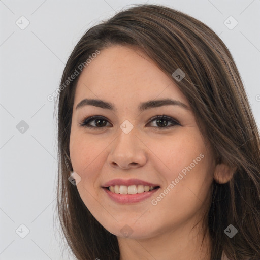 Joyful white young-adult female with long  brown hair and brown eyes