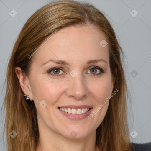 Joyful white adult female with long  brown hair and brown eyes