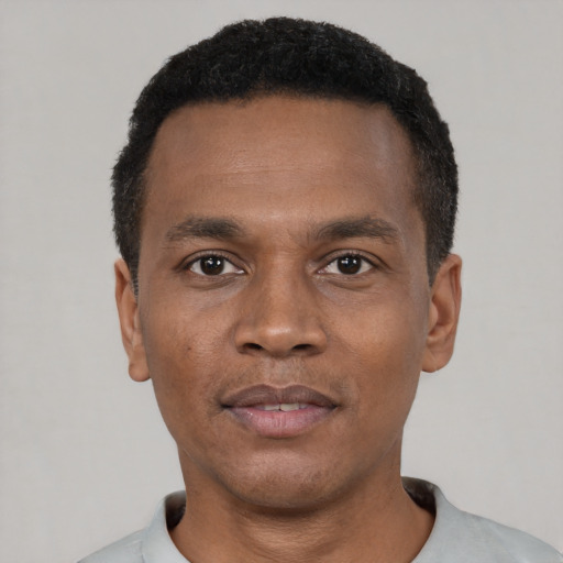 Neutral black young-adult male with short  black hair and brown eyes