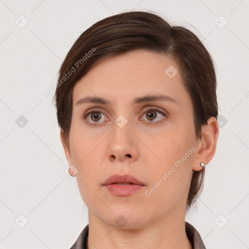 Neutral white young-adult female with short  brown hair and brown eyes