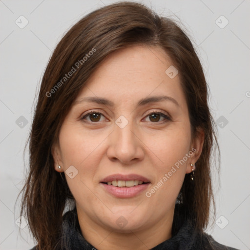 Joyful white adult female with medium  brown hair and brown eyes