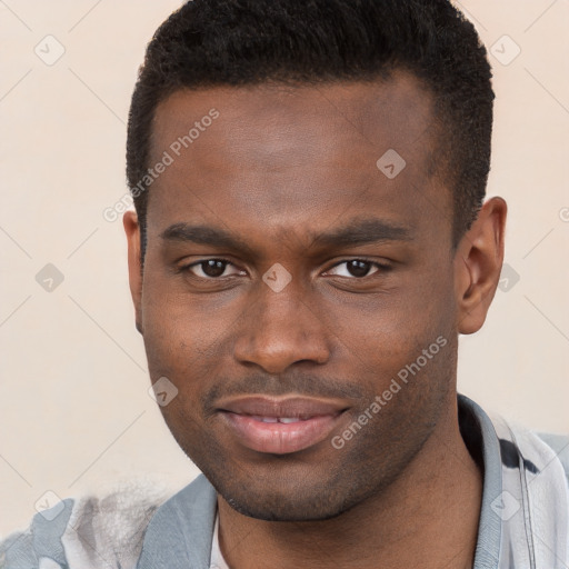 Joyful black young-adult male with short  brown hair and brown eyes