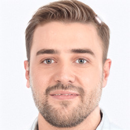 Joyful white young-adult male with short  brown hair and grey eyes