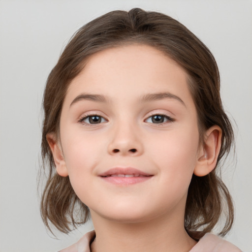 Joyful white child female with medium  brown hair and brown eyes