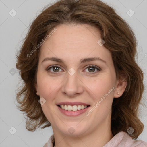 Joyful white young-adult female with medium  brown hair and green eyes