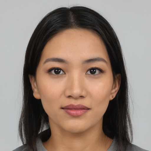 Neutral latino young-adult female with long  black hair and brown eyes