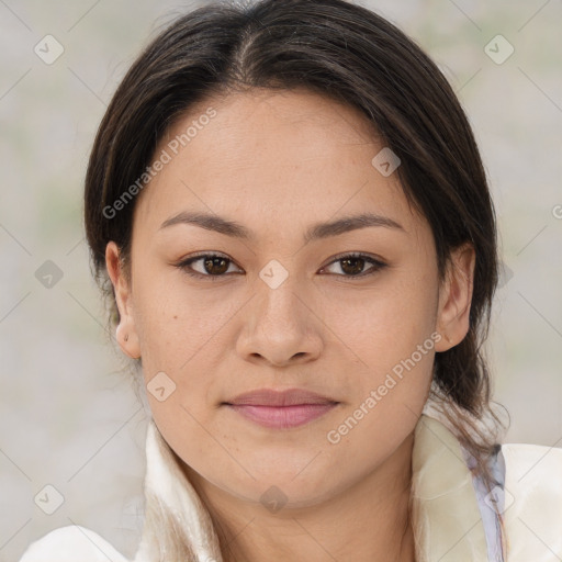 Joyful latino young-adult female with medium  brown hair and brown eyes