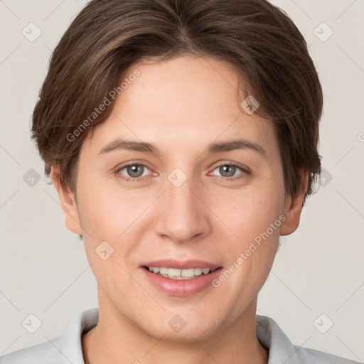 Joyful white young-adult female with short  brown hair and grey eyes