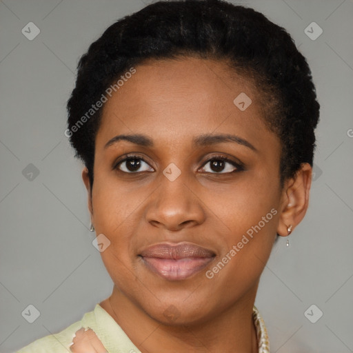 Joyful black young-adult female with short  black hair and brown eyes