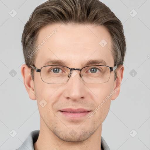 Joyful white adult male with short  brown hair and grey eyes