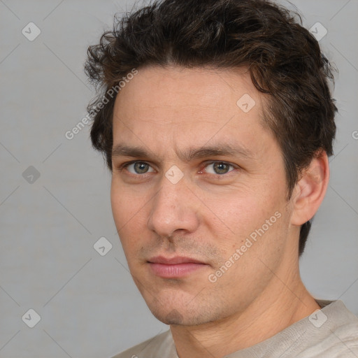 Neutral white adult male with short  brown hair and brown eyes