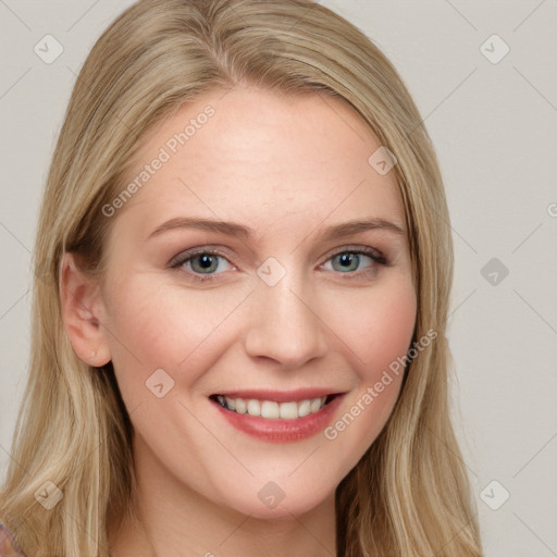 Joyful white young-adult female with long  brown hair and blue eyes