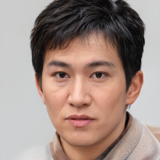 Neutral asian young-adult male with short  brown hair and brown eyes