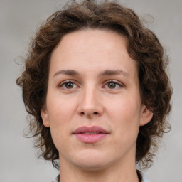 Joyful white young-adult female with medium  brown hair and green eyes