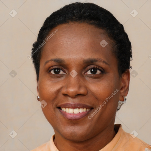 Joyful black adult female with short  brown hair and brown eyes