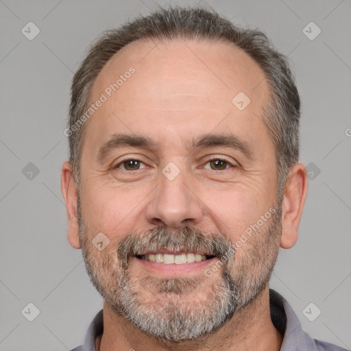 Joyful white adult male with short  brown hair and brown eyes