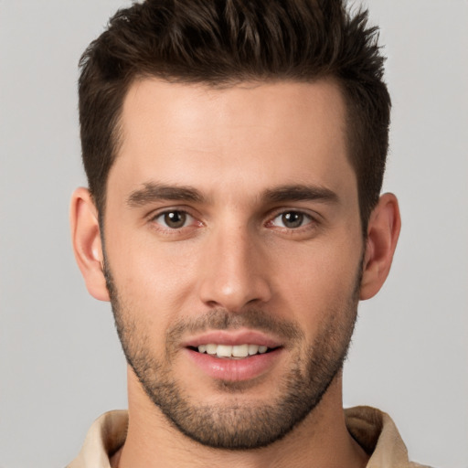 Joyful white young-adult male with short  brown hair and brown eyes