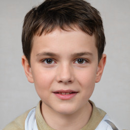 Joyful white child male with short  brown hair and brown eyes