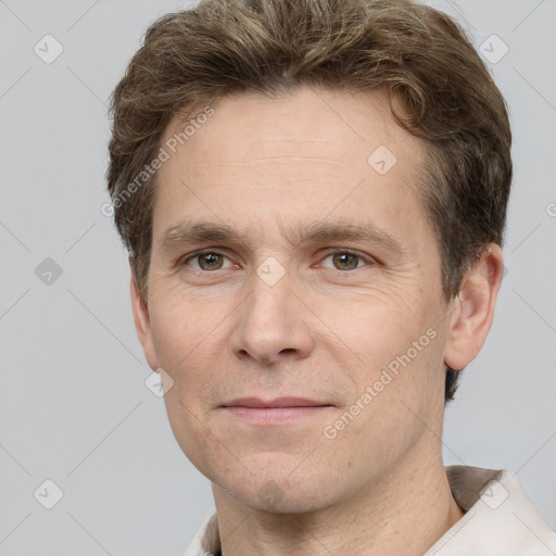 Joyful white adult male with short  brown hair and grey eyes