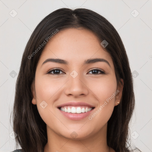 Joyful white young-adult female with long  brown hair and brown eyes