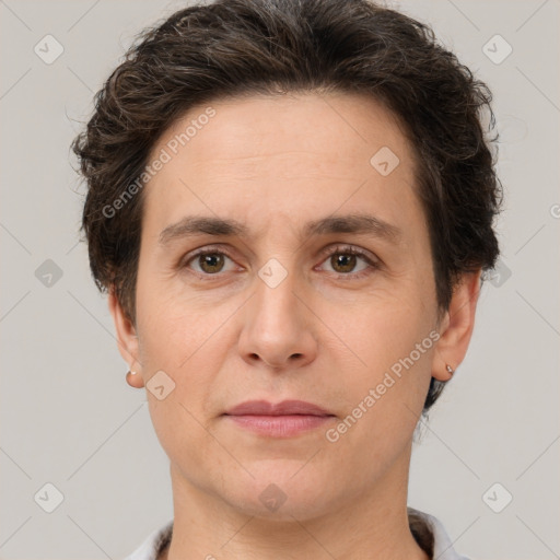 Joyful white adult female with short  brown hair and brown eyes