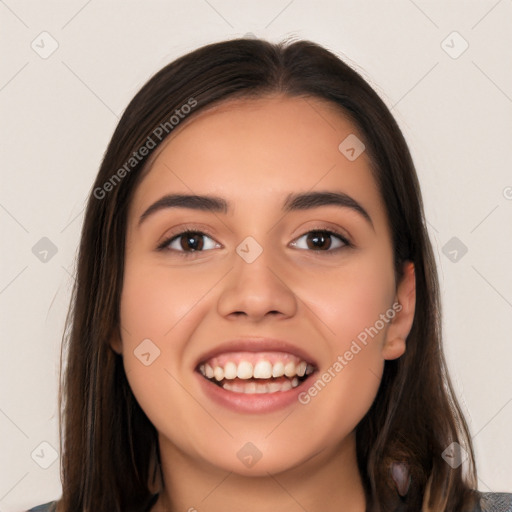 Joyful white young-adult female with long  brown hair and brown eyes