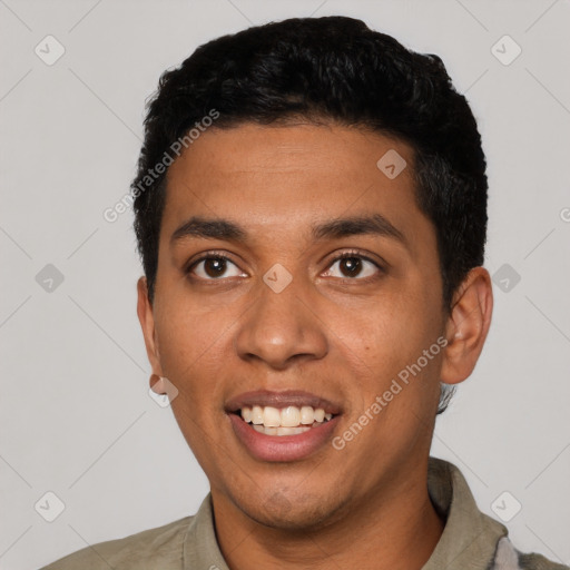 Joyful latino young-adult male with short  black hair and brown eyes