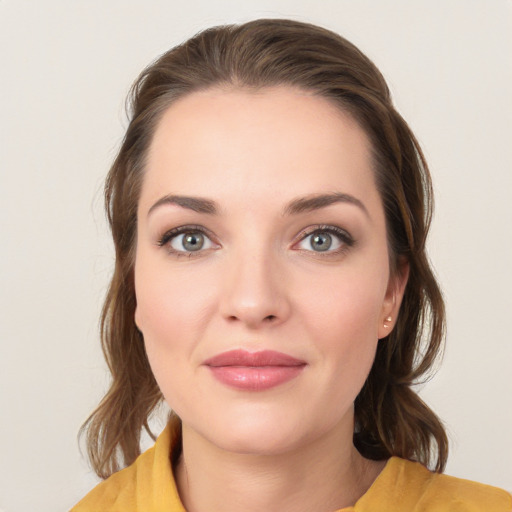 Joyful white young-adult female with medium  brown hair and brown eyes