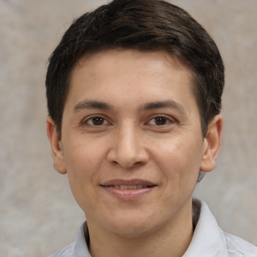 Joyful white young-adult male with short  brown hair and brown eyes