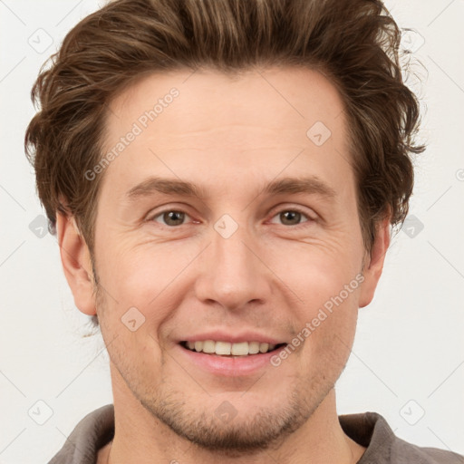 Joyful white adult male with short  brown hair and grey eyes